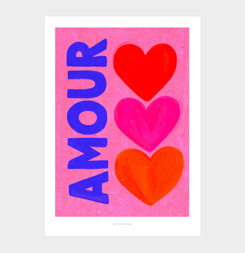 Graphic print of red, pink, and orange hearts with hand-painted “AMOUR” text, cheerful art for bedroom or living room.