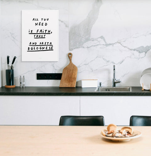 Funny kitchen wall art with a black and white quote saying "All you need is faith, trust and pasta bolognese". Bold and funny wall art.