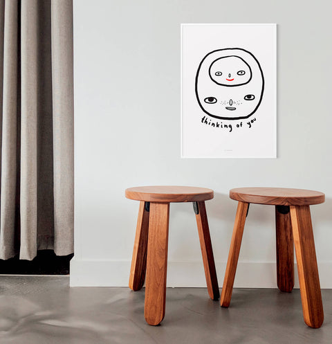 Black and white posters with hand drawn phrase saying "Thinking of you", featuring a head and inside a smaller head.