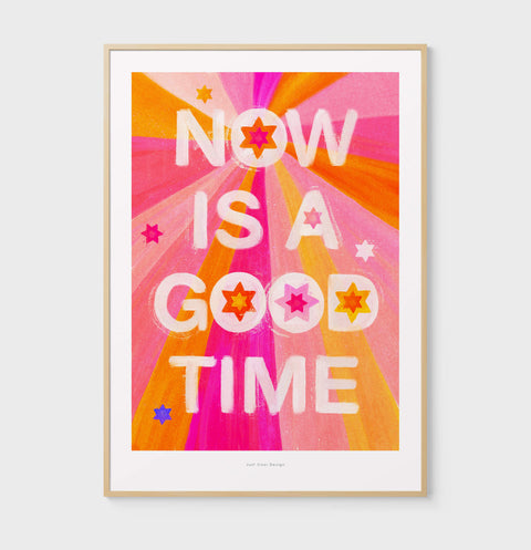 Whimsical typography art print about mindfulness and the importance of living now, featuring hand lettered quote saying "now is a good time" with warm color palette in pink and yellow.