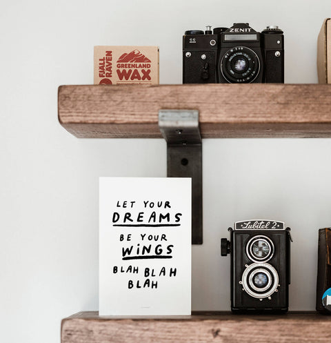 Sarcastic poster with a cynical quote that says "let your dreams be your wings blah blah blah". For people who don't like the usual inspirational quotes prints