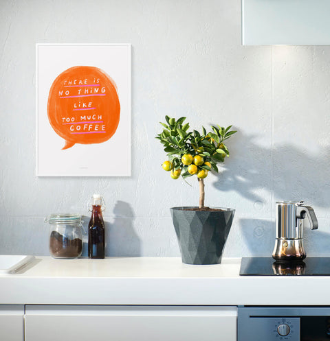 Funny kitchen wall quotes with a bright orange speech bubble and hand lettered typography saying "There is no such thing like too much coffee". Painted with bold brush strokes and hanging on a modern minimalist kitchen wall.