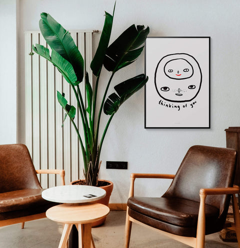 Black and white posters with hand written quote "Thinking of you", illustration print in mid century modern living room. Black and white posters, living room prints
