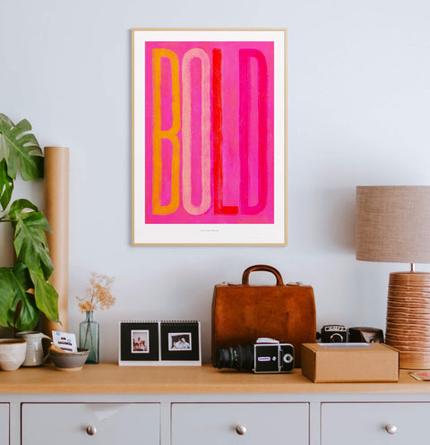Bold and colorful typography art print featuring the word "BOLD" in hand painted bold letters, a red and pink vibrant color palette and distressed texture.