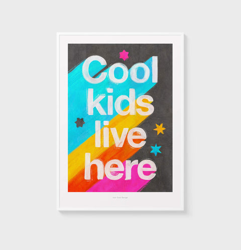 Bold and colorful quote wall art print with the phrase "cool kids live here". Modern and contemporary nursery room decor. Cool kid poster with vibrant colors and retro vibes.