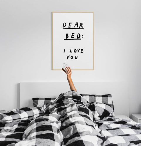 Dear bed I love you poster, bedroom quotes wall art. Black and white hand written quote saying "Dear bed I love you" hanging over the bed.
