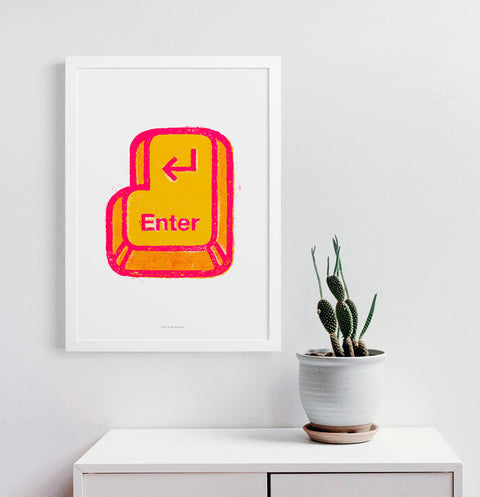 Retro computer wall art featuring an illustration of a yellow and pink enter key.