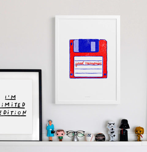 Nerd wall art and geek wall art in modern interior with little geek toys. Floppy disk art in red and blue and the quote "good memories". modern colorful wall art.
