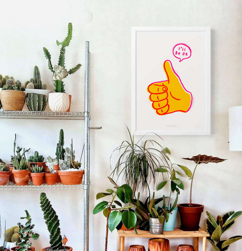 Thumbs up illustration art print with quote saying "I will be ok" in modern living room.