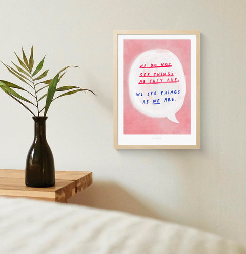 Mindful wall art featuring a hand painted bold speech bubble and inside a hand drawn typography quote saying "we do not see things as they are, we see things as we are", on warm pink background. Illustration typography print with painterly style and an thoughtful message about reality.