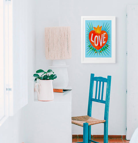 mexican heart illustration print and love art print hanging in mediterranean rustic interior space.