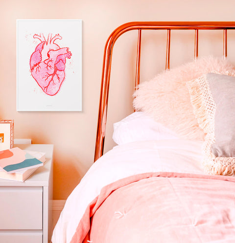Human heart illustration, pink anatomy heart poster hanging in pink bedroom above bed