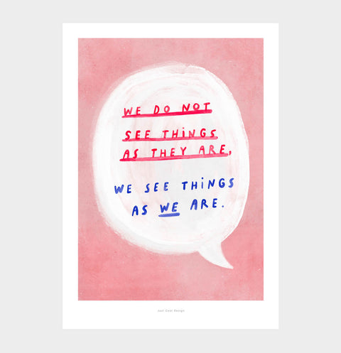 Inspirational wall art featuring a hand painted bold speech bubble and inside a hand drawn typography quote saying "we do not see things as they are, we see things as we are", on warm pink background. Illustrated quote print with painterly style and an inspirational message about reality.