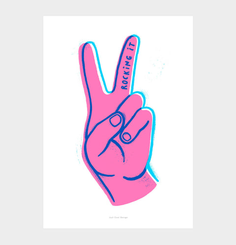 Bold illustration wall art with pink and blue colors featuring a hand making the victory sign with the fingers. Hand written quote saying "Rocking it"